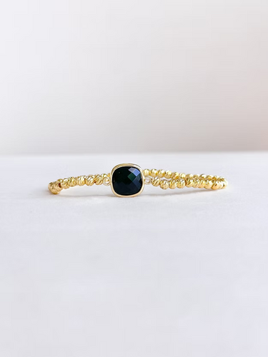Black Stone Stretch Bracelet at 6Whiskey, six whisky, gold beaded bracelet, adjustable, shiny, elevated, everyday chic, modern, timeless, classy, southern charm, texas style, rodeo, country concert, SEC, gameday, everyday stack, layer able, accessory, comfortable fit, front view