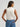 Ivory Cowgirl Snap Vest by Wrangler at 6Whiskey, six whisky, womens sleeveless denim snap shirt, dual front flap pockets, wrangler stitching logo, front placket, wide collar, tank, cropped, texas chic, western modern, versatile, summer, spring, warm weather, gameday, rodeo, concert, lunch, everyday western, comfortable, back view