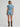 Light wash ranch romper by Wrangler at 6Whiskey, six whisky, Women’s denim snap utility romper, wide collar, snap closure, adjustable belt, front pockets, side pockets, cuffed short sleeves and shorts, durable, year-round, modern western, flattering, casual western, SEC gameday, tailgate, sports season, breathable, summer, spring, back view