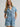Light wash ranch romper by Wrangler at 6Whiskey, six whisky, Women’s denim snap utility romper, wide collar, snap closure, adjustable belt, front pockets, side pockets, cuffed short sleeves and shorts, durable, year-round, modern western, flattering, casual western, SEC gameday, tailgate, sports season, breathable, summer, spring, front view