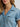 Light wash ranch romper by Wrangler at 6Whiskey, six whisky, Women’s denim snap utility romper, wide collar, snap closure, adjustable belt, front pockets, side pockets, cuffed short sleeves and shorts, durable, year-round, modern western, flattering, casual western, SEC gameday, tailgate, sports season, breathable, summer, spring, collar and front pocket view