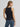 Shadow Stallion Tank by Wrangler at 6Whiskey, six whisky, Cowboy Tank in Lainey Wilson X Wrangler collection, sleeveless, tank top, black, beige ucking bronco rider graphic across front, ribbed cuff, high round neckline, soft, comfortable, breathable, lightweight, summer, spring, layer piece, must-have, retro western, cool girl, it girl, back view