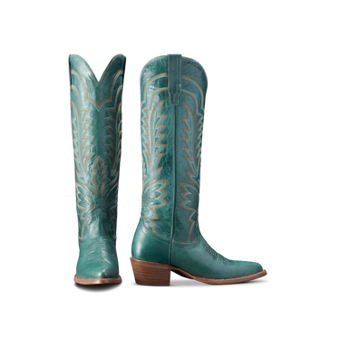 Abby Boot in turquoise by Tecovas at 6Whiskey, six whisky, sagebrush, wholesale exclusive, goat leather, cracked leather, western stitching in caramel and light blue, ivory, light brown wooden stacked 2" leather heel, 17" shaft, tall boot, modern cowgirl, timeless, feminine, fashionable, classy, fun, flirty, sassy, pop of color, rodeo, country concert, southwestern, elevated western, front view.