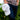 White Ball Cap at 6Whiskey six whisky Texas Standard. Men’s hats department-a close-up of a white cotton ball cap with a tan embroidered barbed wire logo on the front, curved brim, and structured crown, worn with a grey t-shirt against a green outdoor backdrop.