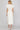 Homefield white dress at 6Whiskey, six whisky, midi dress, zip closure front, v-neck, sleeveless dress, ruffle sleeves, casual dress, cinched waist, game day, tailgating, texas a&m, SEC, back view, full view, midi length, white dress, casual chic dress, gameday outfit, aggie dress, aggies, a&m outfit, gameday attire, aggie style, Ivory ruffle detail, ideal for fall game day or tailgate looks outfit inspo. pockets.