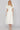 Homefield white dress at 6Whiskey, six whisky, midi dress, zip closure front, v-neck, sleeveless dress, ruffle sleeves, casual dress, cinched waist, game day, tailgating, texas a&m, SEC, front view, full view, midi length, white dress, casual chic dress, gameday outfit, aggie dress, aggies, a&m outfit, gameday attire, aggie style, Ivory ruffle detail, ideal for fall game day or tailgate looks outfit inspo. pockets.