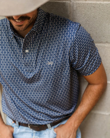 Traditions Polo by Texas Standard at 6Whiskey, six whisky, men's top, mens dress shirt, men's polo, patterned, geometric, short sleeve top, collared shirt, versatile mens top, mens gift, navy blue, deep blue, western, casual. Front view.