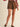 Outlaw Studded Skort at 6Whiskey, six whisky, gold stud detail, front pockets, elastic waistband, panel, soft, comfortable, edgy, western, versatile, closet staple, stand out piece, statement piece, all-year round, round top, rodeo, texas, girls night out, neutral, dark brown, espresso, suede, front view.