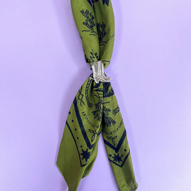 Boot Bandana Slide at 6Whiskey, six whisky, 2 silver boots with spurs, line etch work, doubles as ring, modern western, charming, stylish, country, southern, texas, lone star style, spirit of the west, scarf accessory, banana accessory, front view