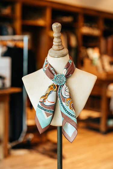 Retro Ropping soft cotton bandana at 6Whiskey six whisky by xoxo art compnay turquoise brown and cream western motif rodeo ready cowboy accessory bucking horse and saddles