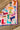 Boot Love Bandana at 6Whiskey six whisky – Colorful Western bandana by XOXO Art Co. featuring cowboy boots in various styles and colors on a pink background. Modern western apparel accessory for rodeo season and everyday western wear