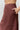 Chocolate Suede Midi Skirt at 6Whiskey, six whisky, side pockets, high waisted, paneling, lines, a-line, flattering, casual western, work wear, office outfit, womens fashion, flowy, fall, winter, transition piece, brown, dark brown, detail view.
