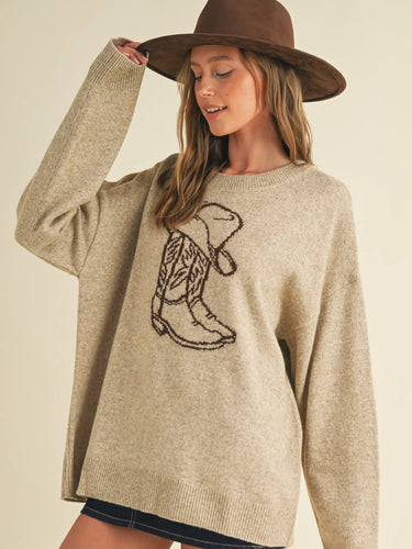 Rodeo Knit Pullover at 6Whiskey, six whiskey, round neckline, crewneck, ribbed hemline, oversized, neutral beige, dark brown, boot graphic, country, western, casual, rodeo, country, country concert, lunch date, market, errands, layer, fall, winter, cooler weather, front view.