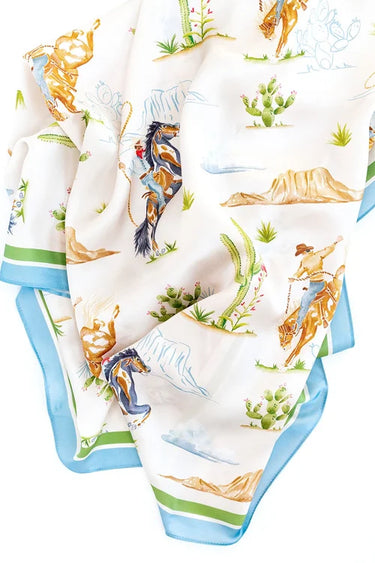Rodeo Cowboy Scarf by Catherine Cartie at 6Whiskey, six whisky, silk scarf, square scarf, lightweight, artsy, rodeo, bucking cowboy, cactus, desert, grass, blue outline sketch, blue boarder, green boarder, greens, pop of color, unique, vintage, western inspired. Detail view.