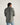 Long Sleeve Performance Pearl Snap in cactus green by Tecovas at 6Whiskey, six whisky, green pearl snaps, brass rings, stretch, comfortable, breathable, texas weather, SEC, southern charm, western stitching, front pockets, lightweight, men's must have, men's gift idea, rodeo, country concert, date night, work, elevated western, sweat proof, ventilated, collared, back view. hidden sunglass wipe, hidden sunglass pocket. sleeve rolled up or down ventilated flap