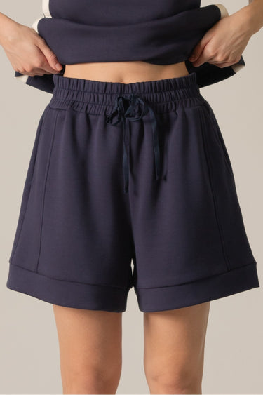 Navy Soft Shorts at 6whiskey, six whisky, high-waisted, draw string waistband, side pockets, mid length, comfortable, bottoms, cozy, soft, women's, women's fashion, set, wide leg, fall. Front view.
