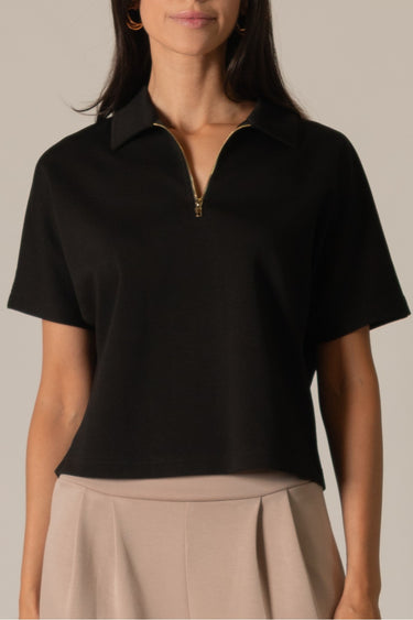 Black Half Zip Top by Pcil at 6Whiskey, six whisky, short sleeve, quarter zip neckline, gold zipper detail, soft, comfortable, cropped, relaxed, loungewear, errands, at home, matching set. Front view.