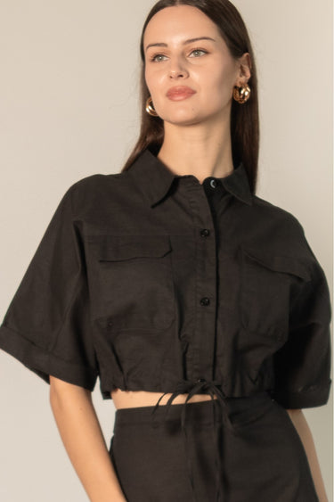 Black Linen Cropped Top by Pcill at 6Whiskey, six whisky, button down, collar, draw string detail, lightweight, breathable, western, country, casual, everyday, pockets, short sleeve, cool girl, sleek. Front view.