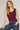 woman wearing a fitted sleeveless maroon knit tank paired with high-rise jeans – ideal for fall game day or tailgate looks at 6whiskey six whisky texas a&m aggies