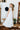 The Prairie Lace Dress by Tasha Polizzi at 6Whiskey, six whisky, Paris dress, white maxi dress, tiered, embroidery, delicate, elegant, feminine, western, chic, stylish, it girl, country concert, rodeo, church, lunch, two stepping, concho button, ruffle hemline, ruffle neckline, flowy, flattering. Back view.