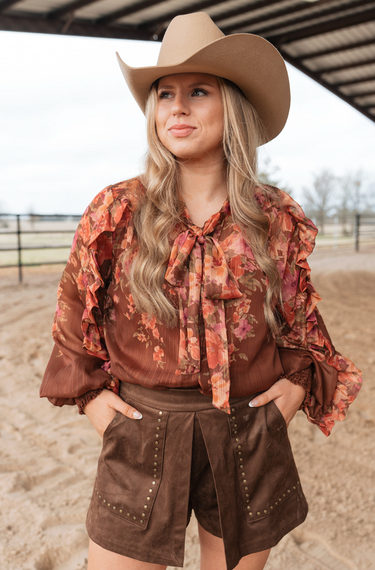 Heirloom Floral Blouse at 6Whiskey, six whisky, bow detail at the neck, lightweight, breathable, front buttons, ruffle detail, smocked cuff, billowy sleeves, long sleeve blouse, spring summer top, women's elevated western, chic, work outfit, work to weekend, church outfit, NFR, stockyards night out, easter blouse, front view