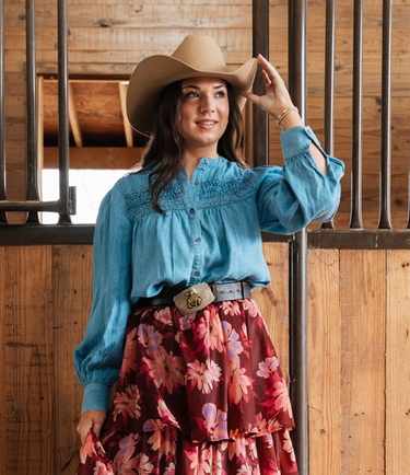 Heritage Smocked Denim Blouse at 6Whiskey, six whisky, long sleeve, balloon sleeve, cuff, placket, western yolk detail, breathable, lightweight, warm weather, frill detail, southern charm, SEC, church blouse, rodeo, brunch date, weekend outfit, modern western, casual, casual western, women's fashion, women's clothing, front view.