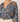 Woman wearing the Cleobella Allison Blouse in Magnolia at 6Whiskey six whisky, a long-sleeve boho floral top in deep blue with earthy tones. Perfect for workwear, brunch, or everyday boho-chic fashion. Stylish and versatile blouse for effortless transitional dressing.