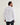 Long Sleeve Performance Pearl Snap in White by Tecovas at 6Whiskey, six whisky, off white pearl snaps, brass rings, stretch, comfortable, breathable, texas weather, SEC, southern charm, western stitching, front pockets, lightweight, men's must have, men's gift idea, rodeo, country concert, date night, work, elevated western, sweat proof, ventilated, collared, back view.