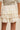 Cream Lace Tiered Shorts at 6Whiskey, six whisky, trendy, pinterest board, trendy, fall shorts, layer piece, western, vintage, romantic, country concert, rodeo, lunch date, market outfit, tie detail, bow, high waisted, short, modest length, lined, comfortable, flowy, flattering, back view.