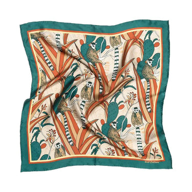 Madagascar Silk Bandana at 6Whiskey, six whisky, square, lightweight, breathable, Africa, cactus, lemur, plants, teal, orange, cream, blue, green, light orange, boarder, western accessory, fashion, unique, eye-catching, neck, bag, belt loop, front view.