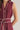 Aggie darling dress at 6Whiskey, six whisky, midi dress, adjustable belt, sleeveless dress, casual dress, western, contrast piping detail, collar, game day, tailgating, texas a&m, SEC, up close front view, button up front closure, maroon dress, burgundy dress, gameday outfit, casual chic aggie dress, aggies, a&m outfit, belted waist dress, removable belt, v-neck dress.