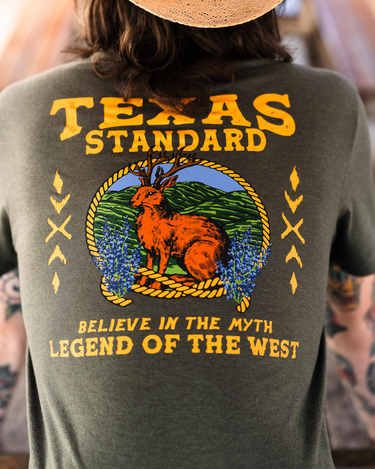 Texas Standard Jackalope tee at 6Whiskey six whisky lightweight and breathable. Texas Standard short sleeve cool wrinkle-resistant. Heathered green legend of the west tee. Backview graphic design on tee.