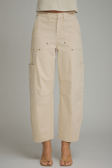 Kickoff cargo pants at 6whiskey, six whisky, woman wearing cream cargo barrel pants, ideal for fall game day or tailgate looks at texas a&m, aggies, SEC, gameday outift inspo, cargo barrel jeans, button details, front view, football game outfit, watch party look, game day to everyday look. Pair with maroon or burgundy aggie accessories and sneakers, sandals, or booties. Texas A&M aggie style. Everyday casual chic aggie style. Barrel pants for fall fashion. Pockets, belt loops, zip fly closure.