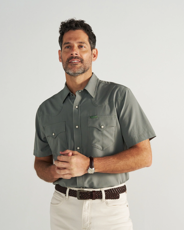 Short Sleeve Performance Pearl Snap in Cactus green by Tecovas at 6Whiskey, six whisky, collar, western yolk stitching, ventilation, UV proof, UPF protection, sweat proof, stretchy, moves with you, comfortable, spring, summer, short sleeves, keeps you cool, warm weather top, date night, rodeo, work, everyday, elevated western, stylish, modern western, refined, dark blue, sunglass pocket, front view.