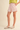 Rosebud Stitched Shorts at 6Whiskey, six whisky, baby pink, light pink, dusty pink, tailored look, pleated, tortoise shell buttons, belt loops, side pockets, faux back pockets, diamond embroidery white hem stitching, high waisted, flattering, feminine, southern charm, southern belle, girly, lined, modest length, summer and spring style, lunch, church, errands, market, casual chic, effortless cool, it girl, polished, put together, refined, side pocket view