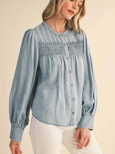 Heritage Smocked Denim Blouse at 6Whiskey, six whisky, long sleeve, balloon sleeve, cuff, placket, western yolk detail, breathable, lightweight, warm weather, frill detail, southern charm, SEC, church blouse, rodeo, brunch date, weekend outfit, modern western, casual, casual western, women's fashion, women's clothing, front view.