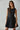 The Essential Black Dress at 6Whiskey, six whisky, flare skirt, pleated, flowy, structured top, sleeveless, little black dress, mini dress, gameday, aggies, texas a&m, tailgate outfit, SEC gameday. Front view.