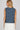 Dotted denim top at 6whiskey, six whisky, woman wearing blue and white polka dot top, ideal for fall game day or tailgate looks at texas a&m, aggies, SEC, gameday outift inspo, sleeveless top, polka dots, back view, football game outfit, watch party look, game day to everyday look. Pair with maroon or burgundy aggie accessories and sneakers, sandals, or booties. Texas A&M aggie style. Everyday casual chic aggie style. polka dot top for fall fashion. Matching set.