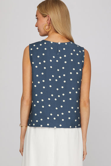 Dotted denim top at 6whiskey, six whisky, woman wearing blue and white polka dot top, ideal for fall game day or tailgate looks at texas a&m, aggies, SEC, gameday outift inspo, sleeveless top, polka dots, back view, football game outfit, watch party look, game day to everyday look. Pair with maroon or burgundy aggie accessories and sneakers, sandals, or booties. Texas A&M aggie style. Everyday casual chic aggie style. polka dot top for fall fashion. Matching set.