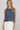 Dotted denim top at 6whiskey, six whisky, woman wearing blue and white polka dot top, ideal for fall game day or tailgate looks at texas a&m, aggies, SEC, gameday outift inspo, sleeveless top, polka dots, front view, football game outfit, watch party look, game day to everyday look. Pair with maroon or burgundy aggie accessories and sneakers, sandals, or booties. Texas A&M aggie style. Everyday casual chic aggie style. polka dot top for fall fashion. Matching set.