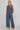 Dotted denim pants and top set at 6whiskey, six whisky, woman wearing blue and white polka dot pants, ideal for fall game day or tailgate looks at texas a&m, aggies, SEC, gameday outift inspo, wide leg pants, polka dots, front view, football game outfit, watch party look, game day to everyday look. Pair with maroon or burgundy aggie accessories and sneakers, sandals, or booties. Texas A&M aggie style. Everyday casual chic aggie style. flowy pants for fall fashion. Pockets, stretchy waist band.