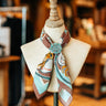 Retro Ropping soft cotton bandana at 6Whiskey six whisky by xoxo art compnay turquoise brown and cream western motif rodeo ready cowboy accessory bucking horse and saddles