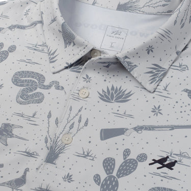 Tin Golf Cup Polo by Two Dove at 6Whiskey, six whisky, collared, short sleeves, relaxed fit, breathable, comfortable, soft, lightweight, moves with you, summer, spring, warm weather, texas, southern, preppy, polished, put together, stretchy, cactus, snake, guns, armadillo, grass, grey, gray, patterned, detail view
