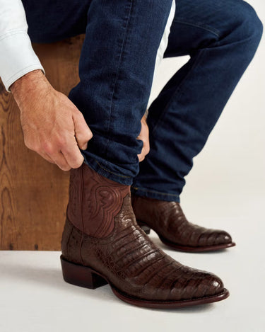 Dillion in Oak Caimen by Tecovas at 6Whiskey, six whiskey, dark brown and light brown, alligator belly vamp, leather shaft with western stitching, leather straps, two-toned, leather heel stacked, leather outsole and insole, comfortable, elegant, elevated, day to night, western, modern, unique, rodeo, country concert, dressy boot, tecovas men's calf boot, side view.
