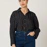 Kiera Blouse by Cleobella at 6Whiskey, six whisky, long sleeve, sheer, brown and white grid pattern, button up, collared, frill detail, elevated, casual western, work wear, office outfit, business casual, business professional, work to weekend. Front view.