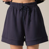 Navy Soft Shorts at 6whiskey, six whisky, high-waisted, draw string waistband, side pockets, mid length, comfortable, bottoms, cozy, soft, women's, women's fashion, set, wide leg, fall. Front view.