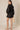 Black Linen Romper at 6Whiskey, six whisky, women's fashion, front tie detail, front wrap, collared neck, elastic wrist cuff, casual, relaxed, chic, effortless, stylish, fall. Back view.