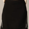 Piping Black Mini Skirt by P.cill at 6Whiskey, six whiskey, white side piping, high elastic waistband, comfy, cozy, sporty, elevated, classy, chic, sleek, matching set, pickleball, errands, loungewear. Front view.