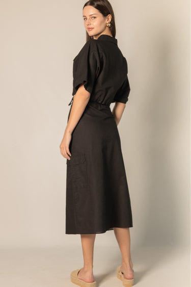 Black Linen Cargo Skirt by Pcill at 6Whiskey, six whiskey, pockets, back elastic waistband, cool girl, elegant western, casual, breathable, tailored, concert, dinner date, night out, matching set. Back view.