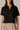 Black Half Zip Top by Pcil at 6Whiskey, six whisky, short sleeve, quarter zip neckline, gold zipper detail, soft, comfortable, cropped, relaxed, loungewear, errands, at home, matching set. Front view.